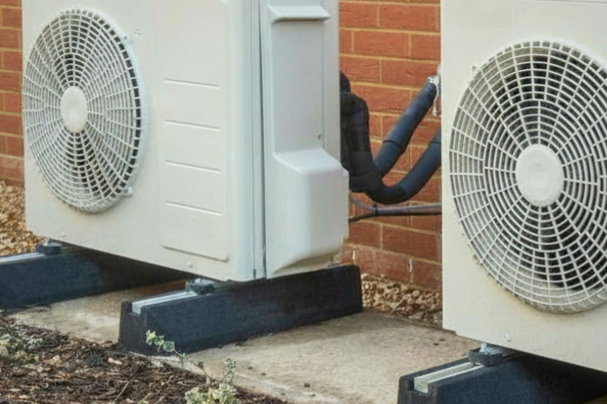 heat pump systems installed on the outside of a residential home